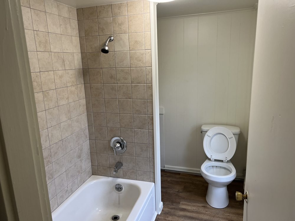 Updated bathroom with tile tub surround