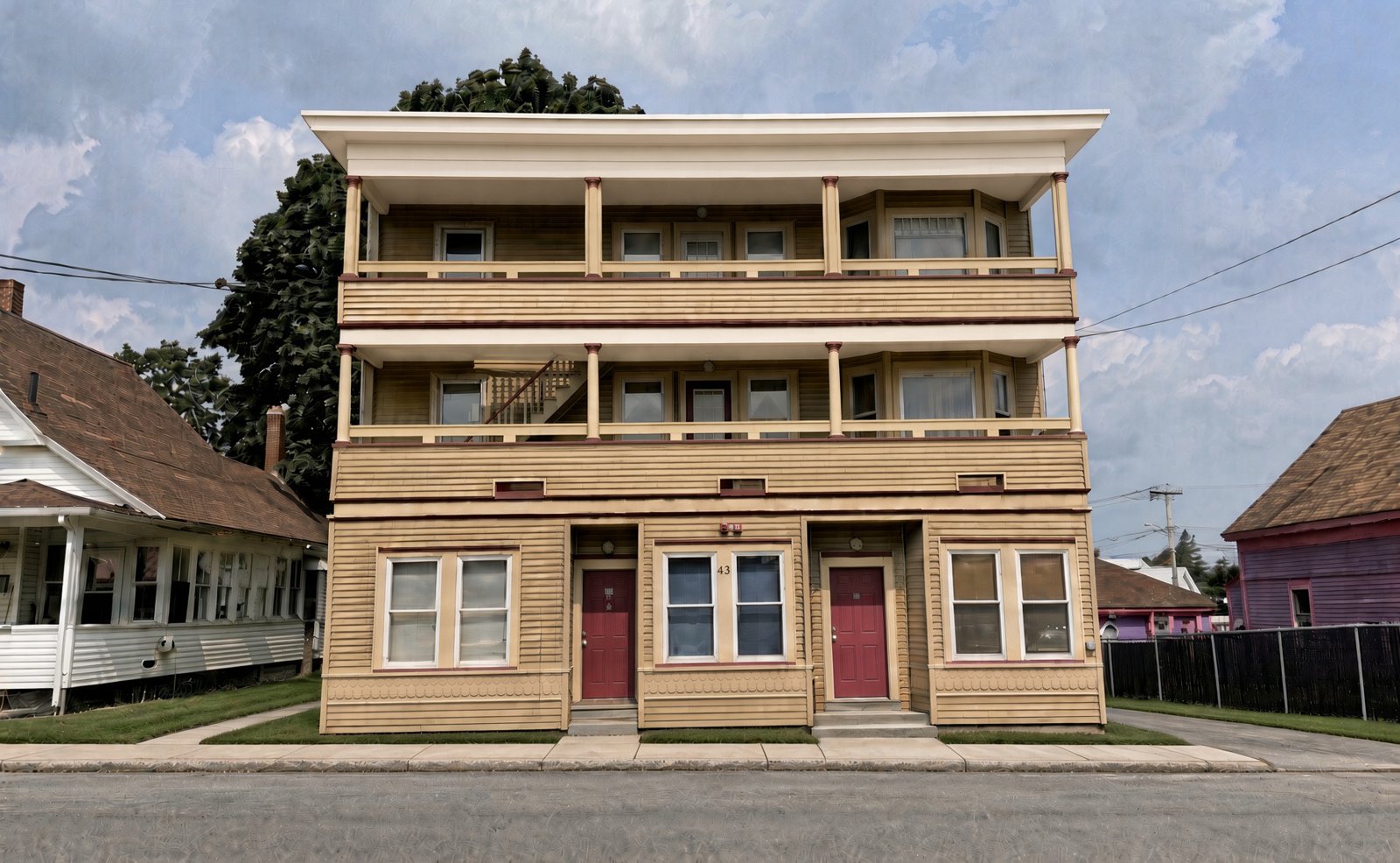 Exterior: 41 River Street, a three-story apartment building with rear decks, Sanford, Maine